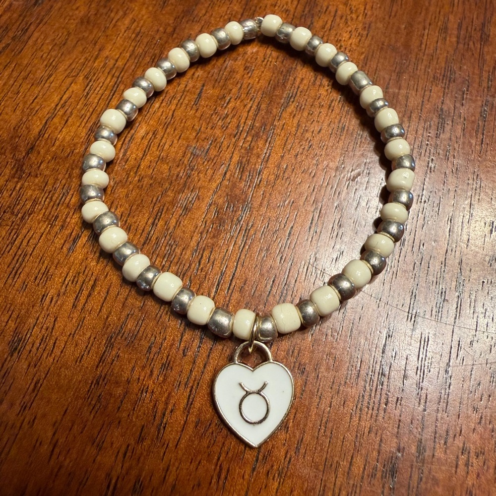 Elegant Cream and Silver Beaded Bracelet with Taurus zodiac Charm